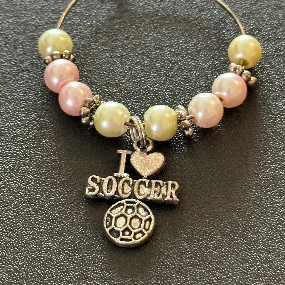 Wine glass tag, stainless steel hoop, yellow/pink beads, soccer charm